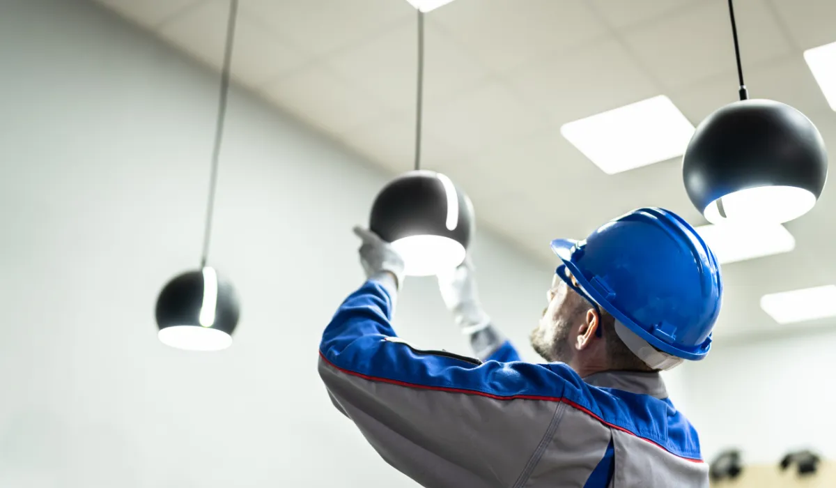 Technician providing onsite lighting repair service
