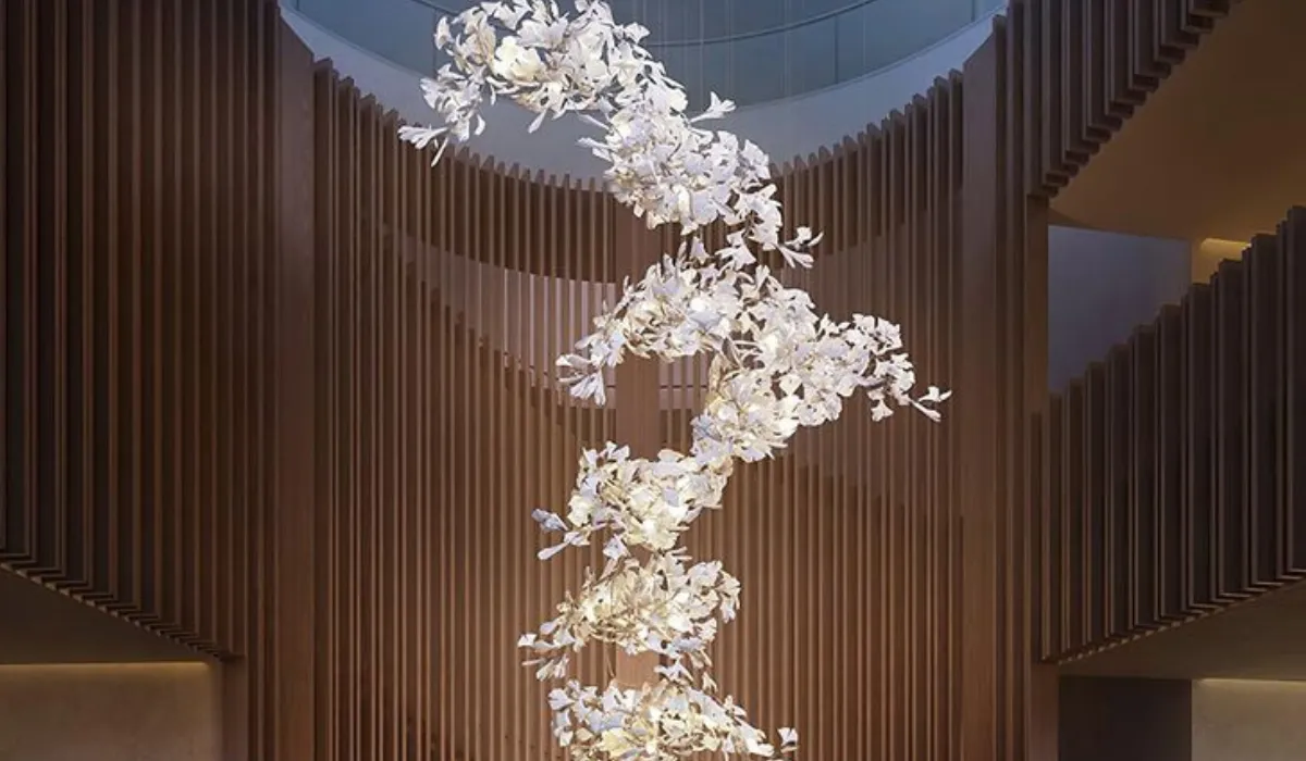 Sculptural chandelier with delicate white accents, creating a striking focal point in a luxury space.