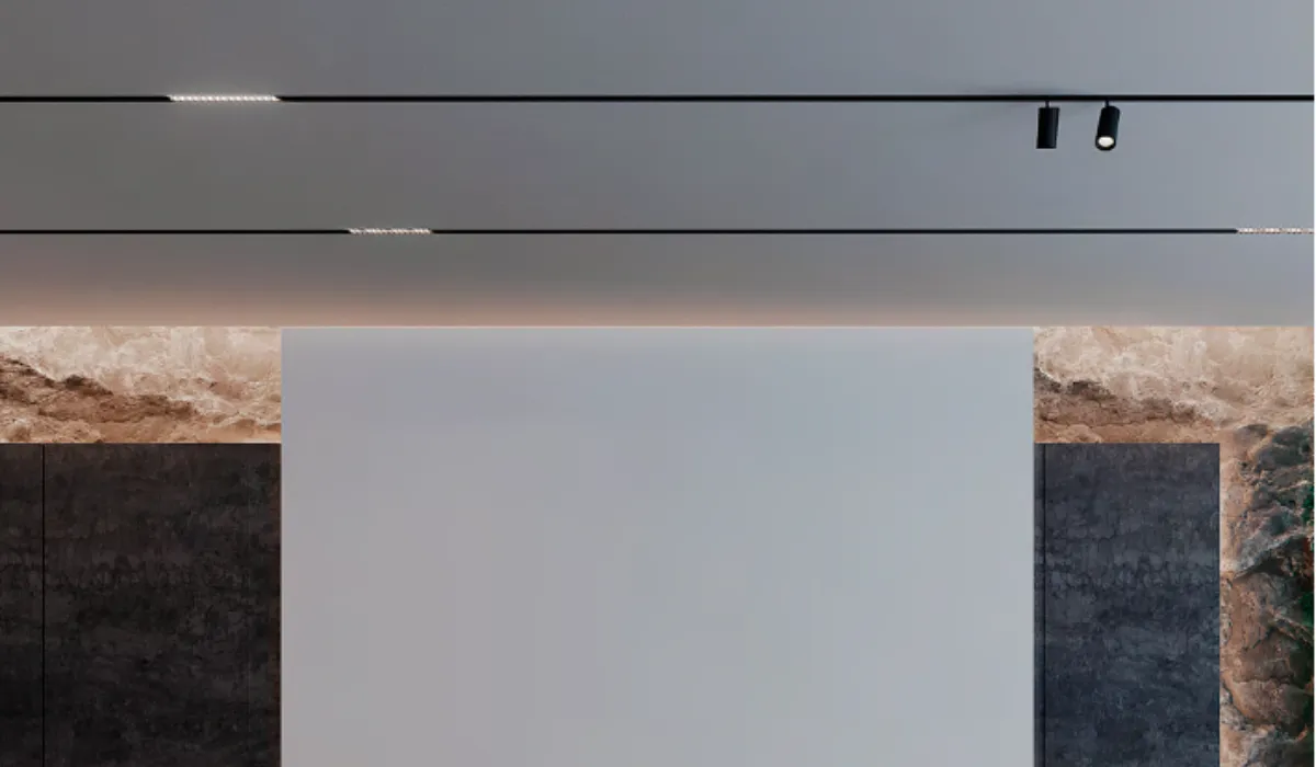 Minimalist ceiling with recessed magnetic track lights for a seamless lighting experience.