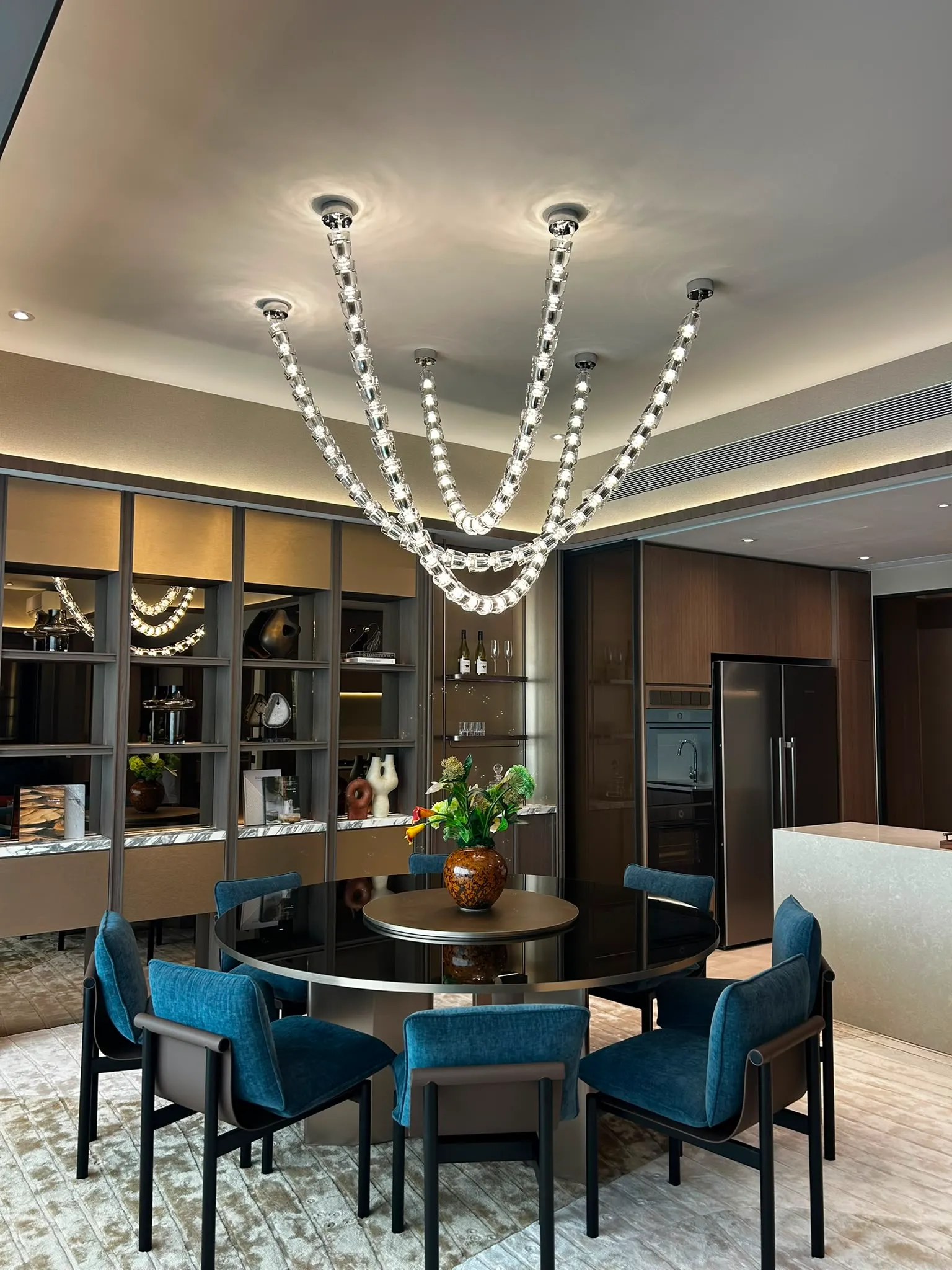 Bespoke designer lighting fixture casting a warm glow in a contemporary space.