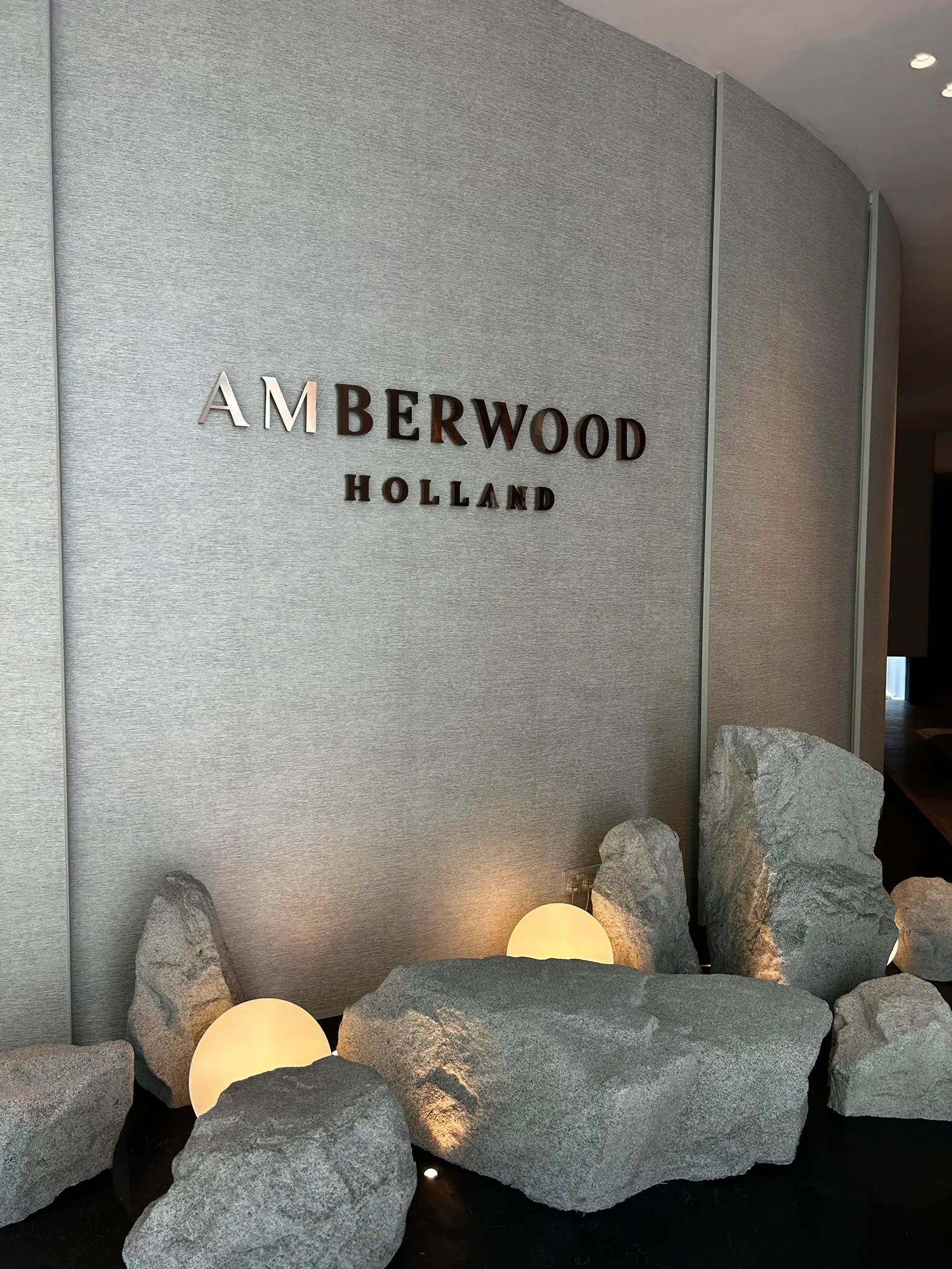 Custom handcrafted designer light casting a warm glow over a dining area.