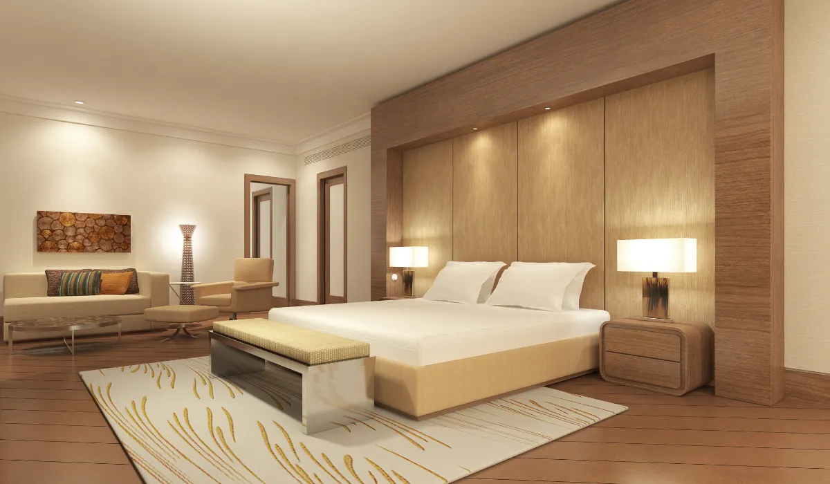 Modern boutique bedroom with elegant floor lamp creating warm, hotel-inspired ambience and cosy luxury.