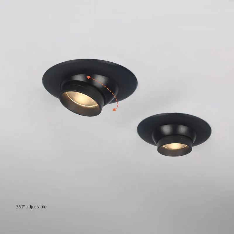 Adjustable black recessed spotlights with tilt and rotation for directional ceiling lighting.