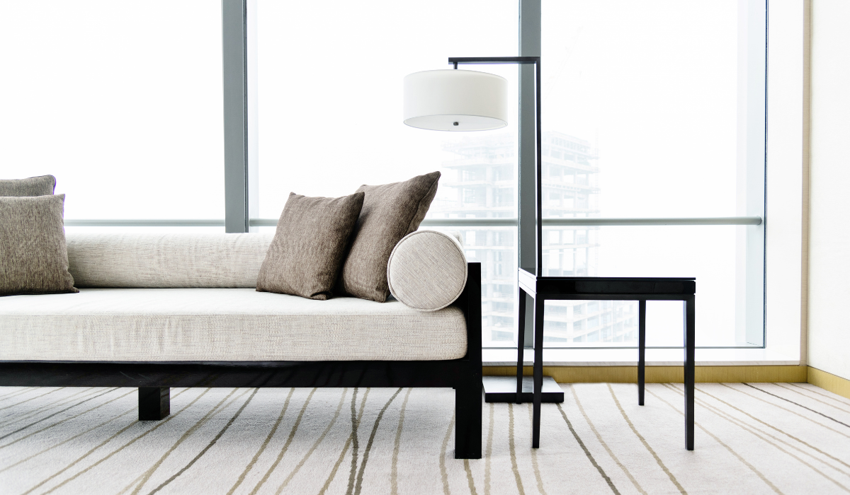 Modern arc floor lamp and table lamp styling a luxury living room corner with a luxury hotel feel.
