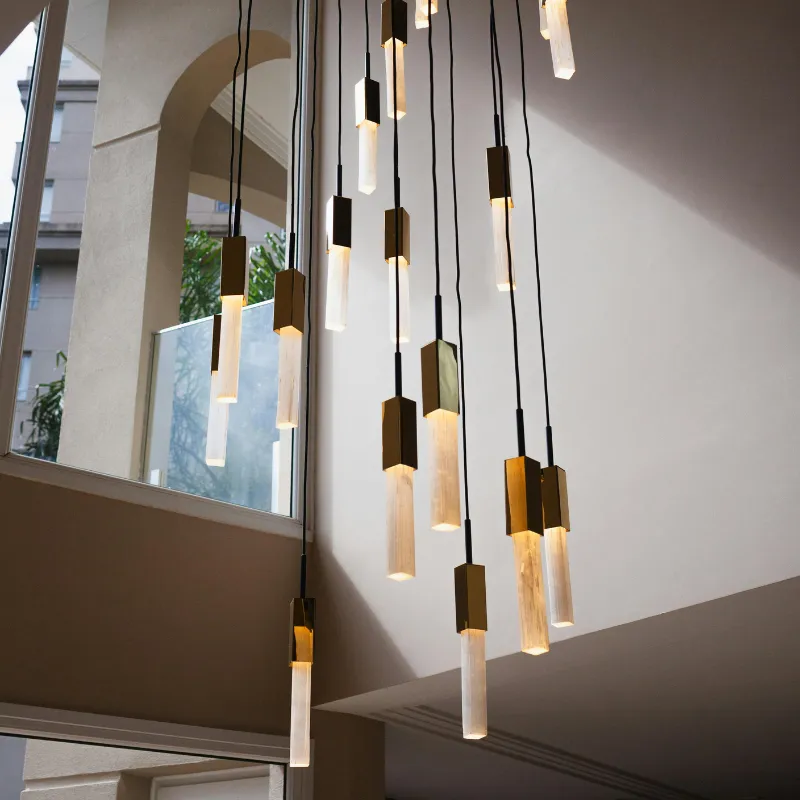 Statement lighting with marble and copper textures.