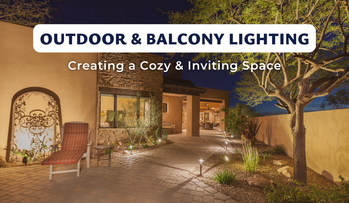 Warm outdoor lighting enhances a cozy patio and garden pathway at night.