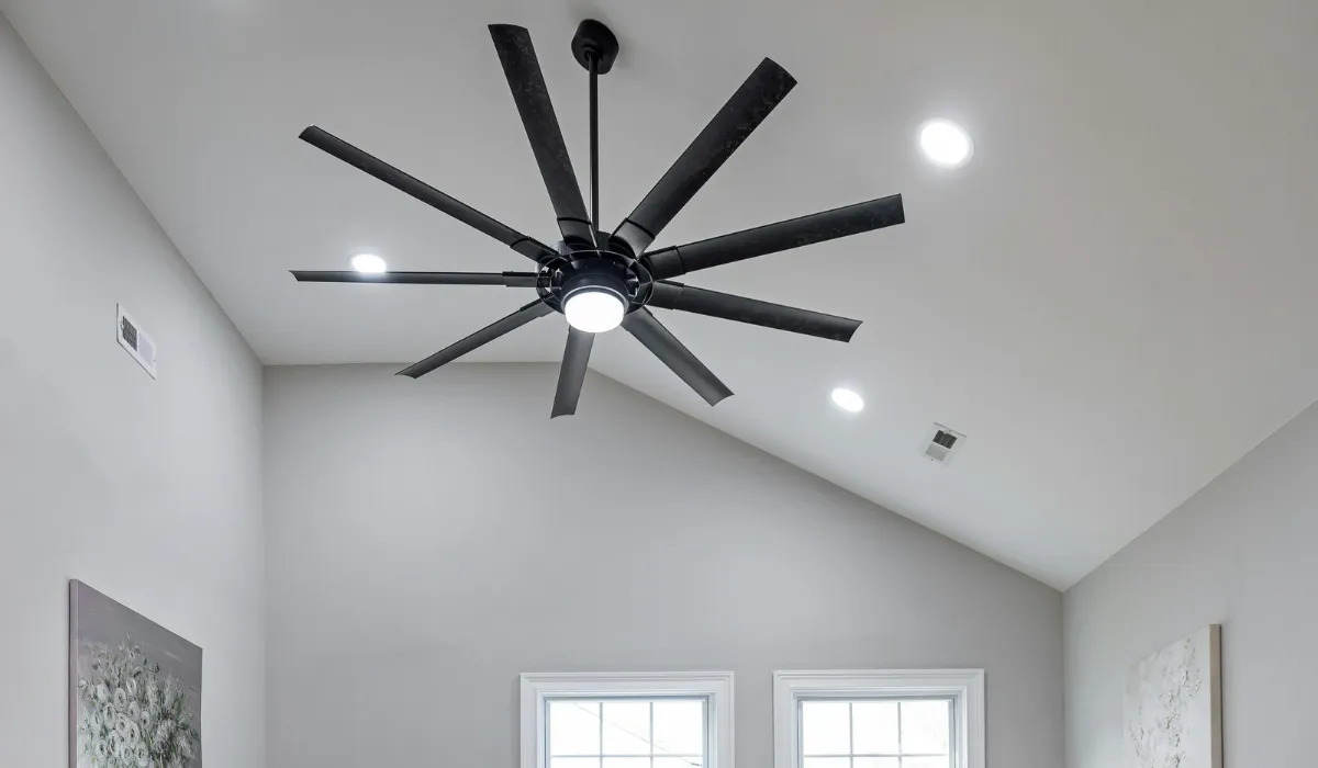 Minimalist bedroom featuring a modern smart ceiling fan with light