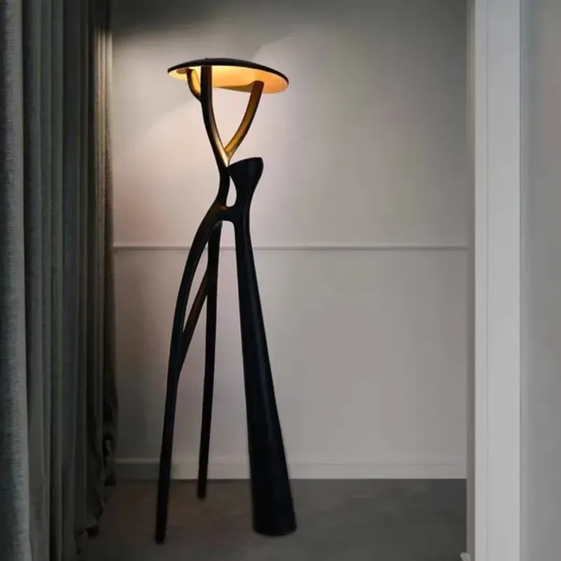 Abstract designer floor lamp in a minimalist living room.
