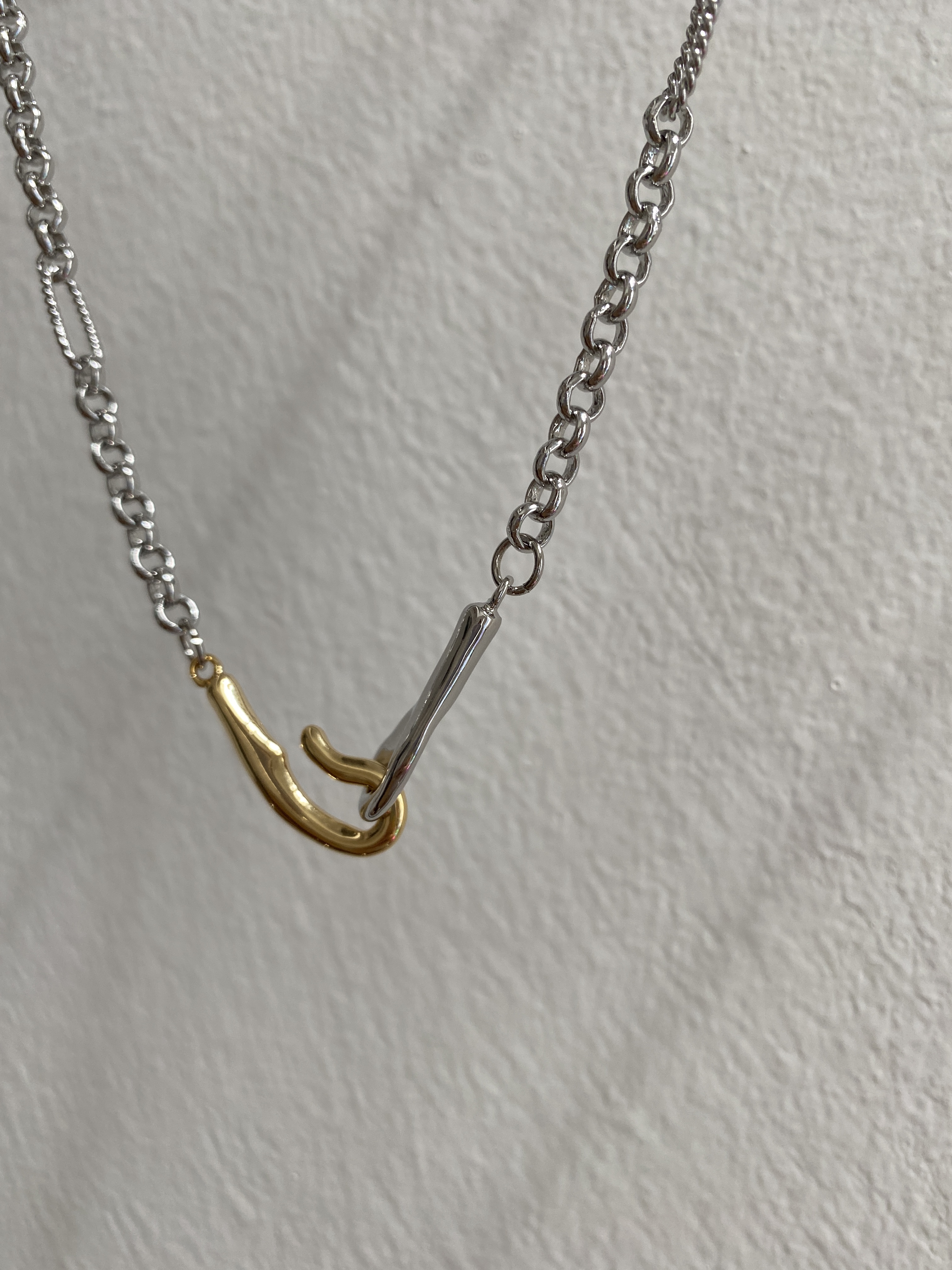 Rolo chain with twisted loop front mix gold hook necklace