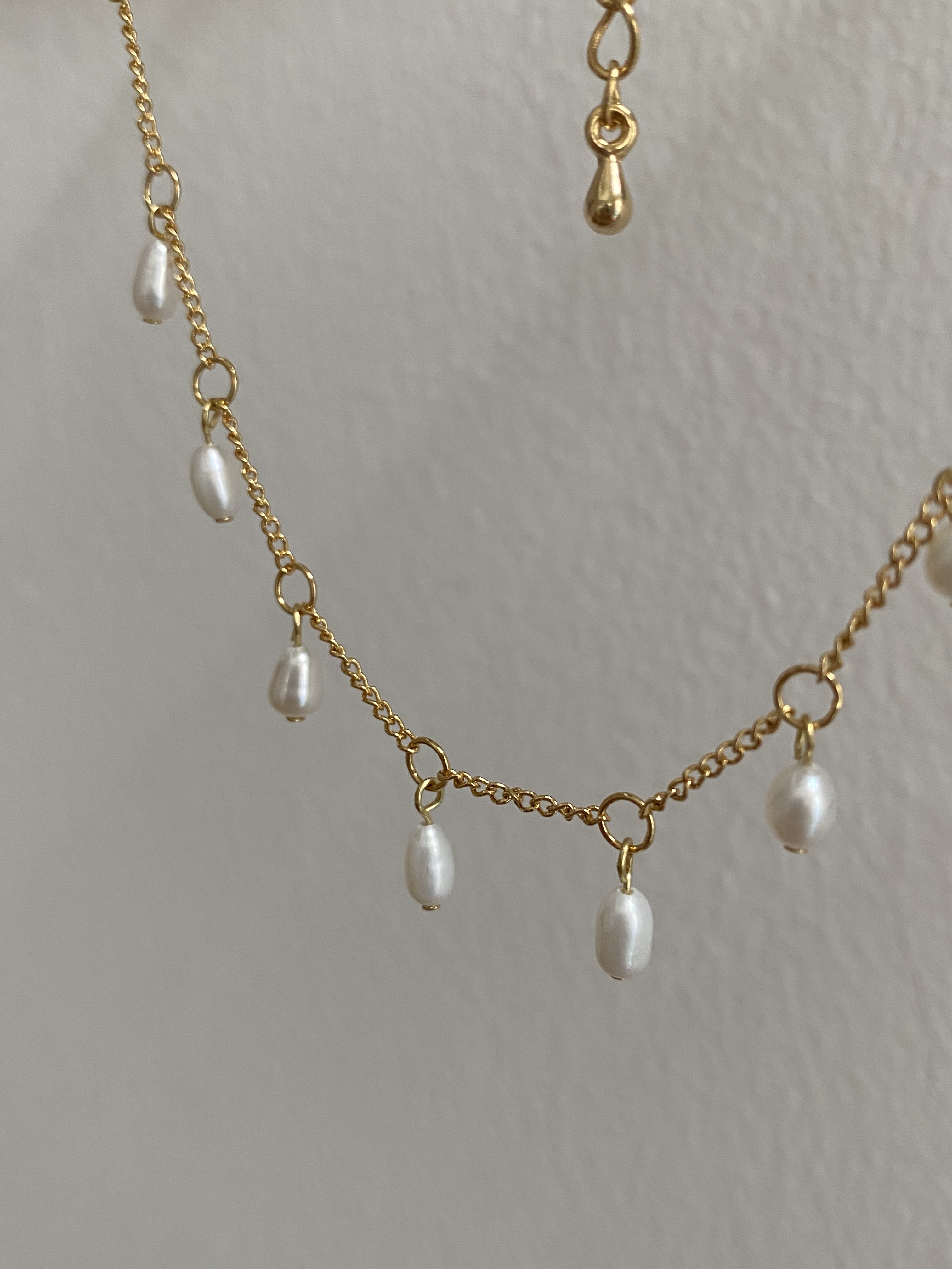 Gold, dangling rice shape freshwater pearls necklace