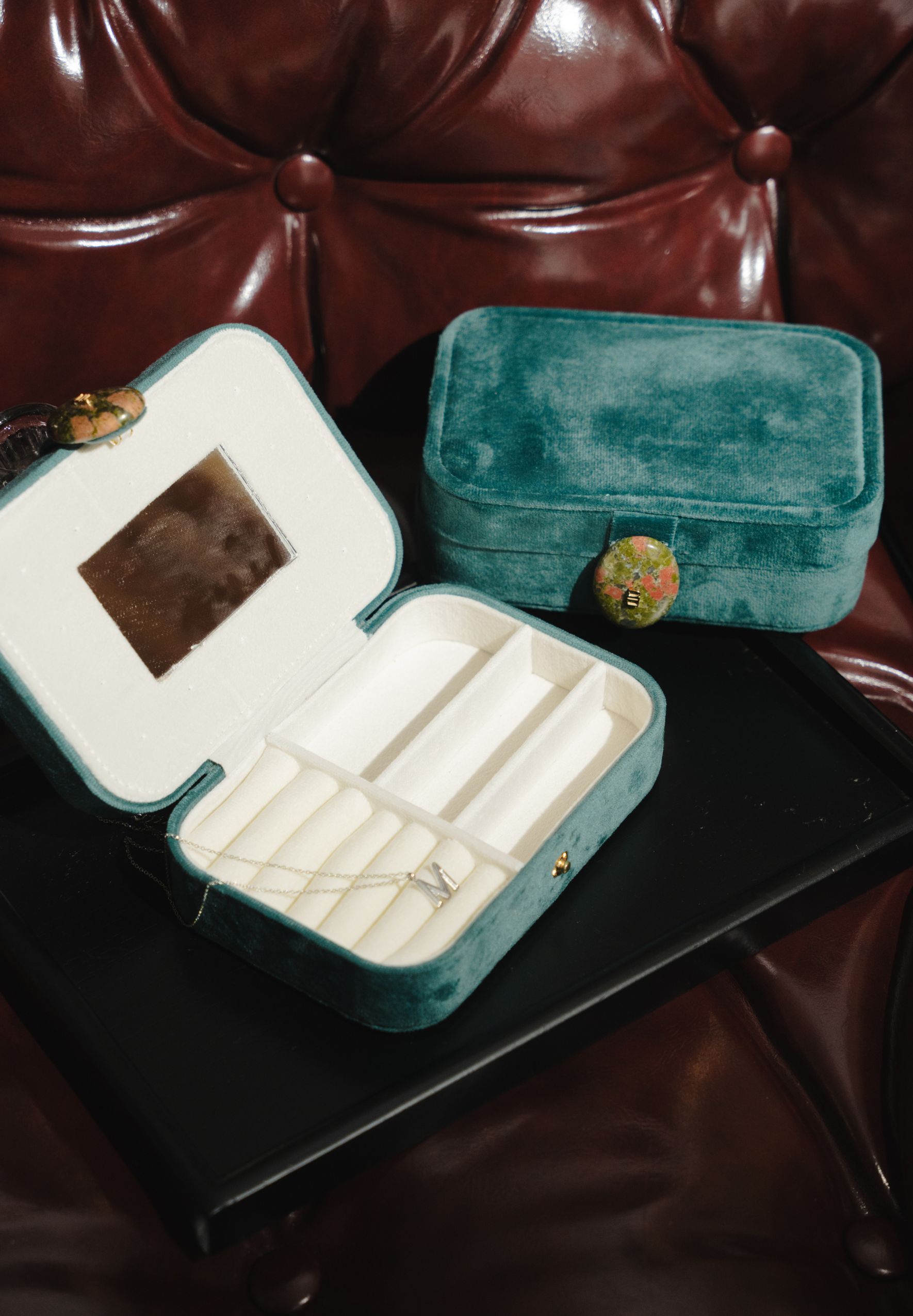 Minimal travel jewellery box with soft compartments for silver necklaces, earrings and charms