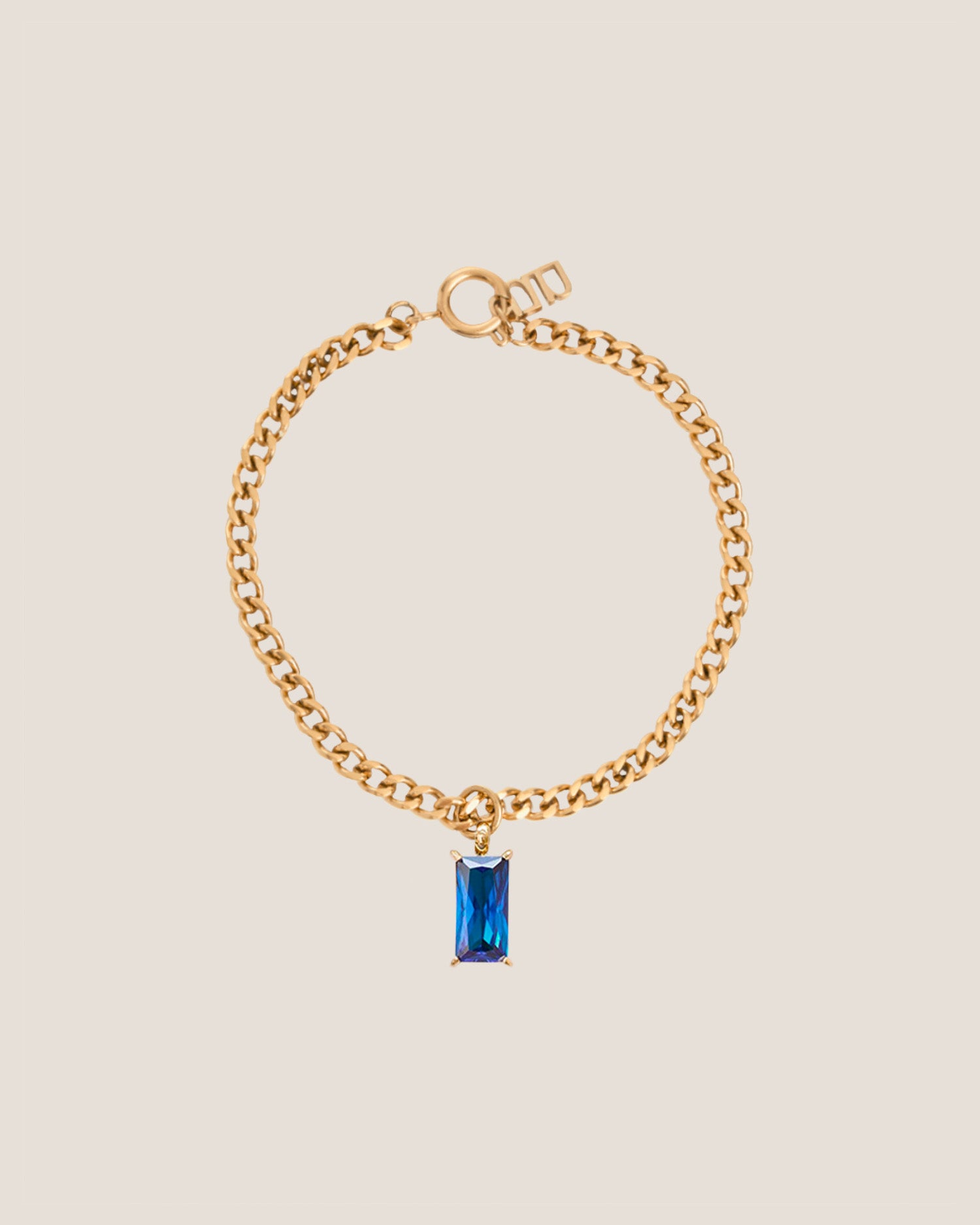 Verity Blue Sapphire Pendant Gold Curb Chain Bracelet