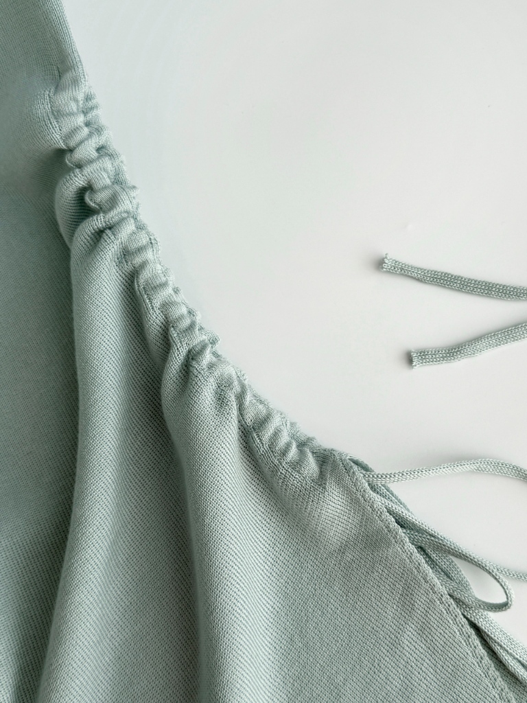 Ellie High Neck Side Ruched Back Button Knit Top