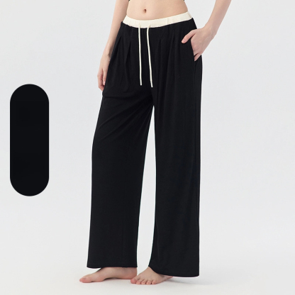 The clouds are loose and cover the hips, And the contrasting color is lazy and wide-leg pants