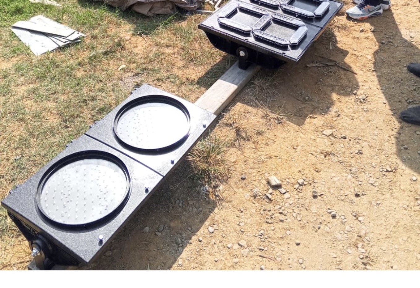 Traffic signal heads and mounting components during ground-level trial assembly