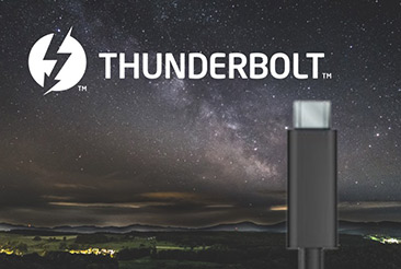 Thunderbolt cables and logo set against a starry night background