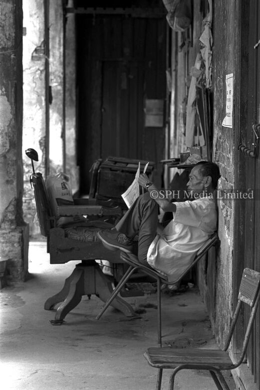 Street Barber Waiting for Customers at Boat Quay 1985