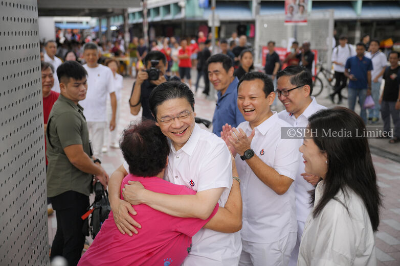 Woman hugging PM Wong during walkabout at Marsiling Market, 2025 Print