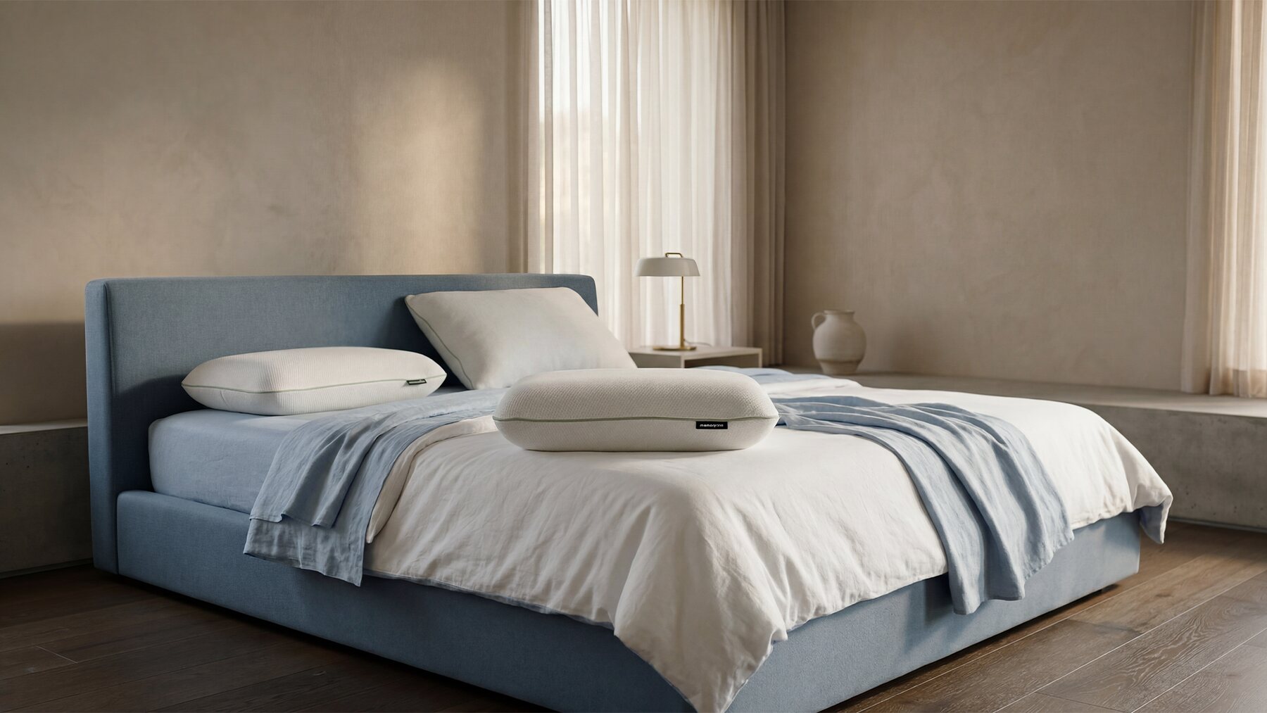 MemoryOne® Hybrid Pillow resting on a freshly made bed in a calm, sunlit bedroom
