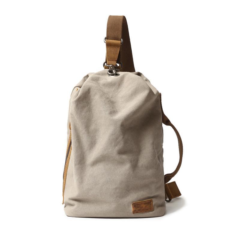 簡約日系文藝帆布胸包復古時尚休閒斜跨水桶包戶外單肩男士揹包