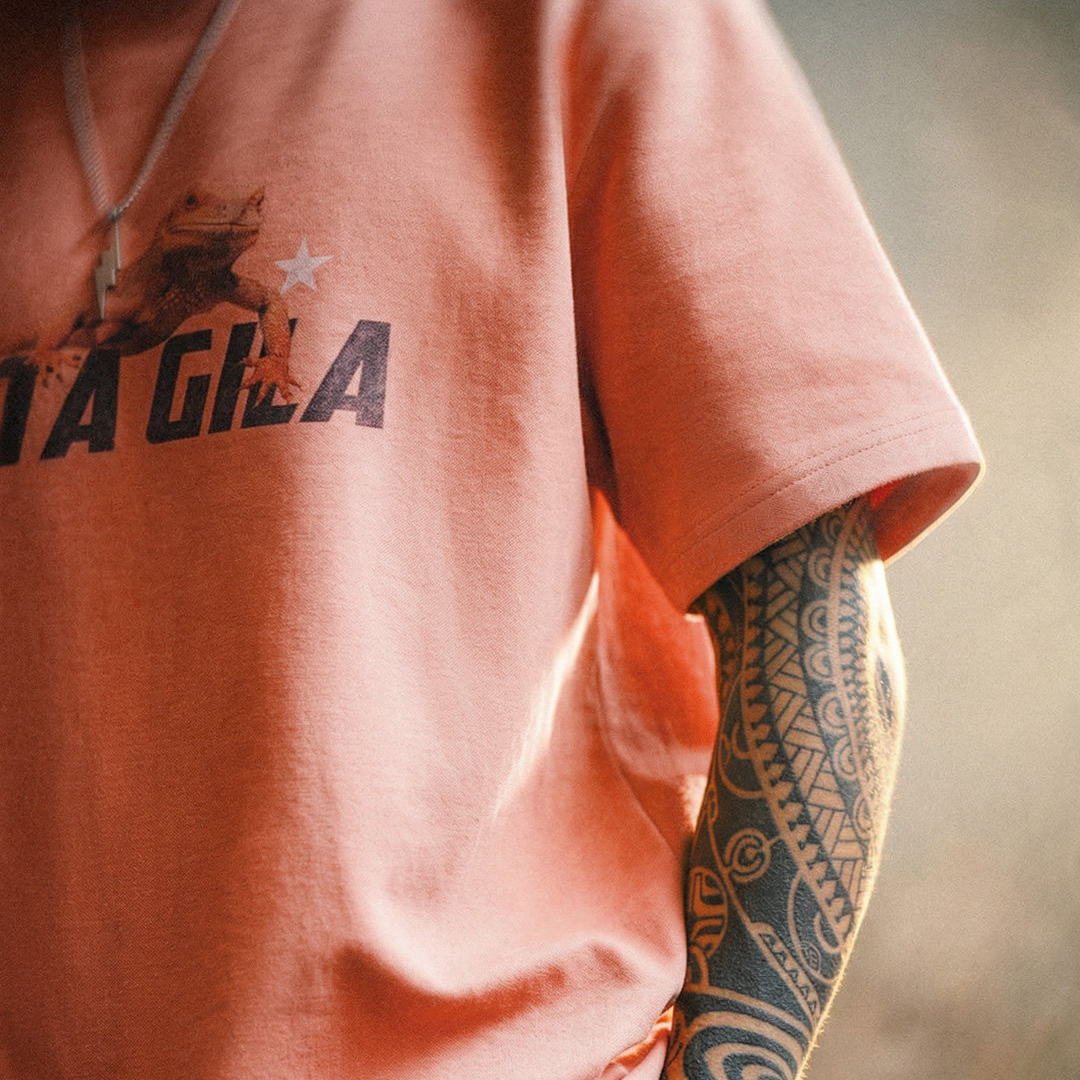 美式復古印花短袖上衣圓領落肩落日橘紅色針織T恤男夏季