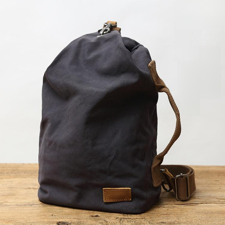 簡約日系文藝帆布胸包復古時尚休閒斜跨水桶包戶外單肩男士揹包