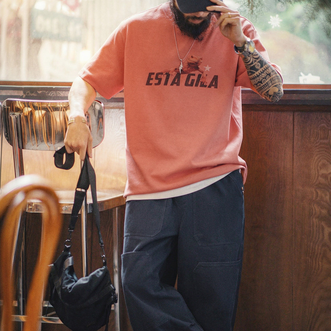 美式復古印花短袖上衣圓領落肩落日橘紅色針織T恤男夏季