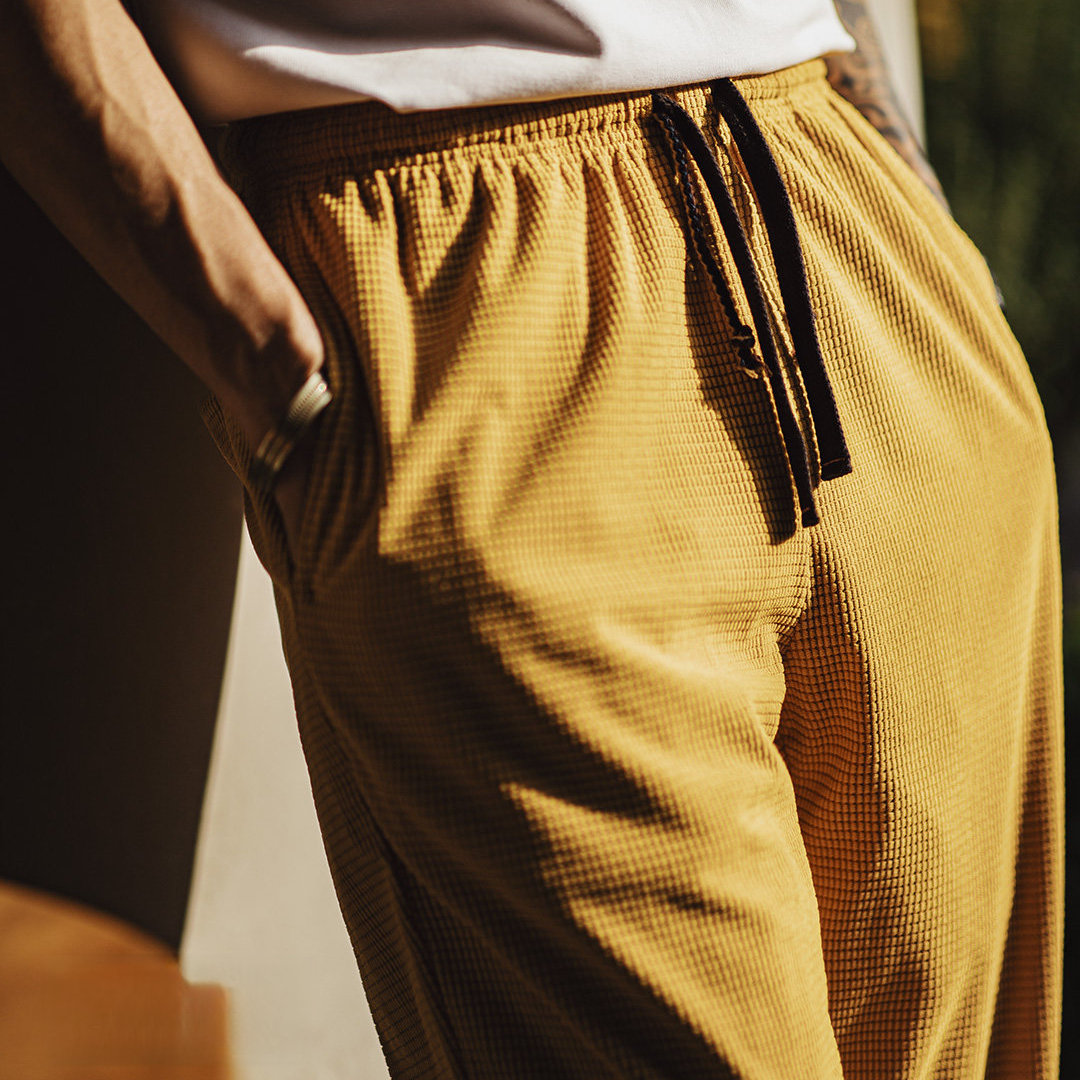 美式方格黃色玉米絨休閒褲直筒抽繩束腳寬鬆長褲子男款春