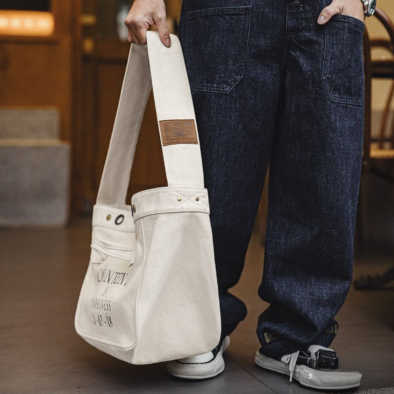 美式復古機車報童包大容量帆布郵差包印花字母斜挎包男生