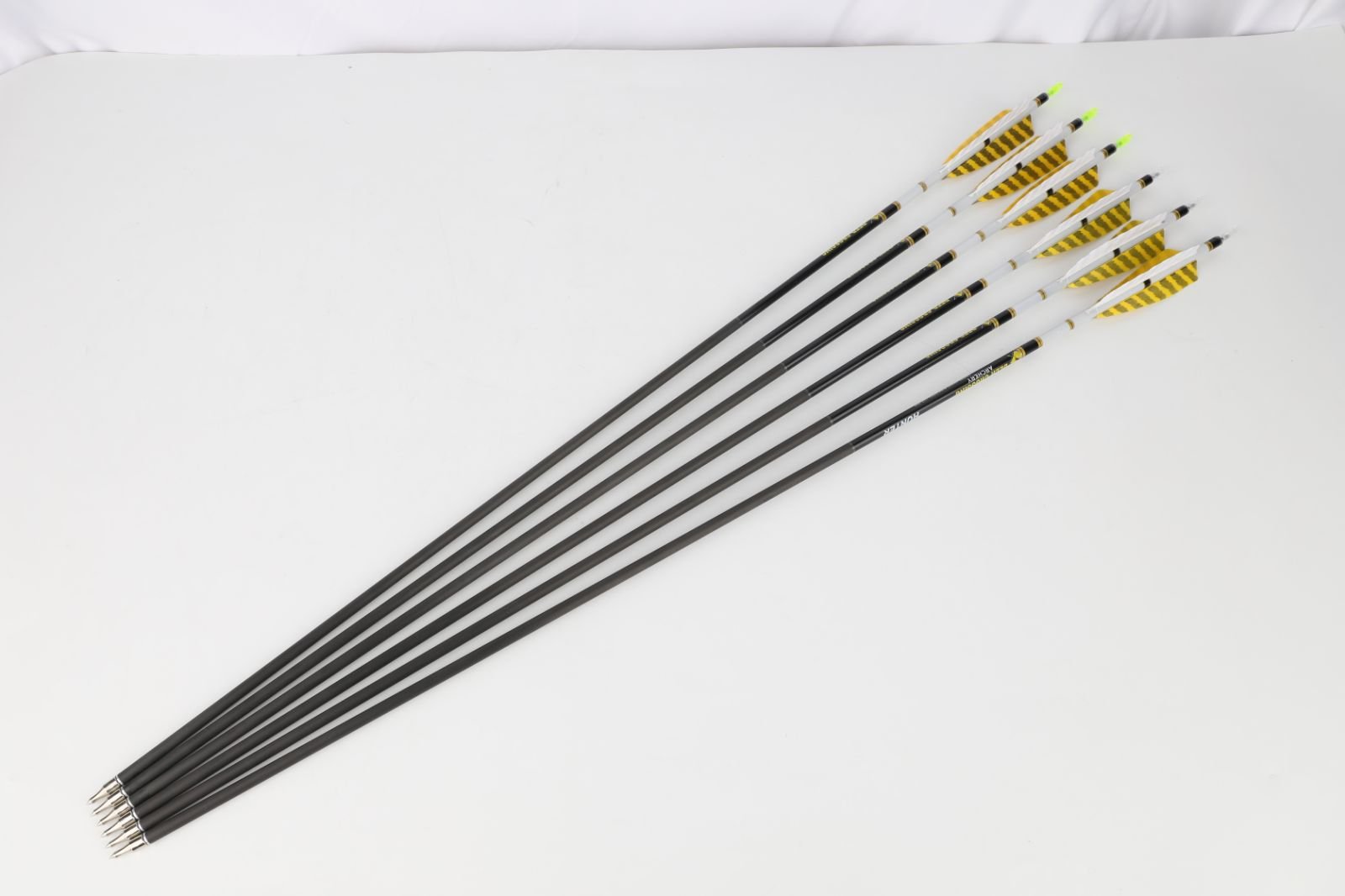 Deer Crossing Pure Carbon Arrow – 2 Yellow 1 White 4" Shield Striped Feather Fletching (12pcs)