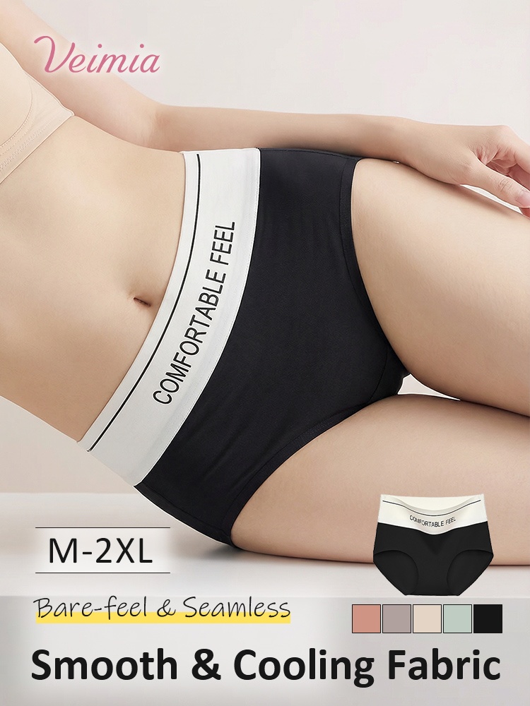 Black high-waist seamless cooling panties on reclining model side view VEIMIA