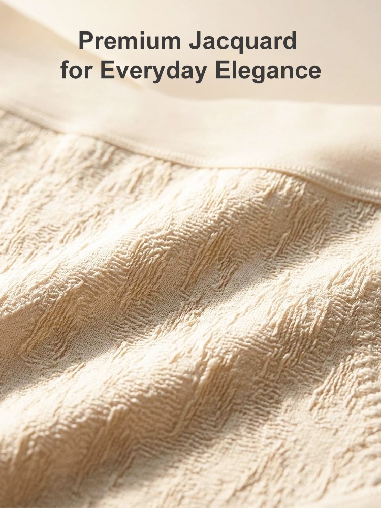 Close-up of ivory jacquard panty fabric texture and smooth waistband VEIMIA