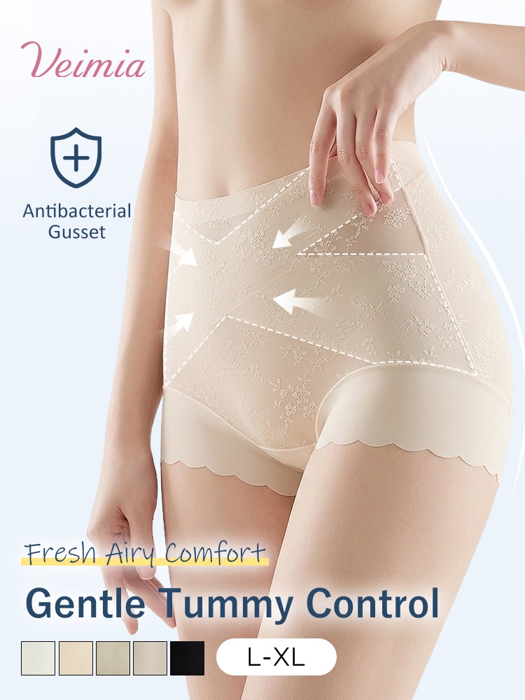 Model wearing beige lace shaping shorts with gentle tummy control graphic VEIMIA