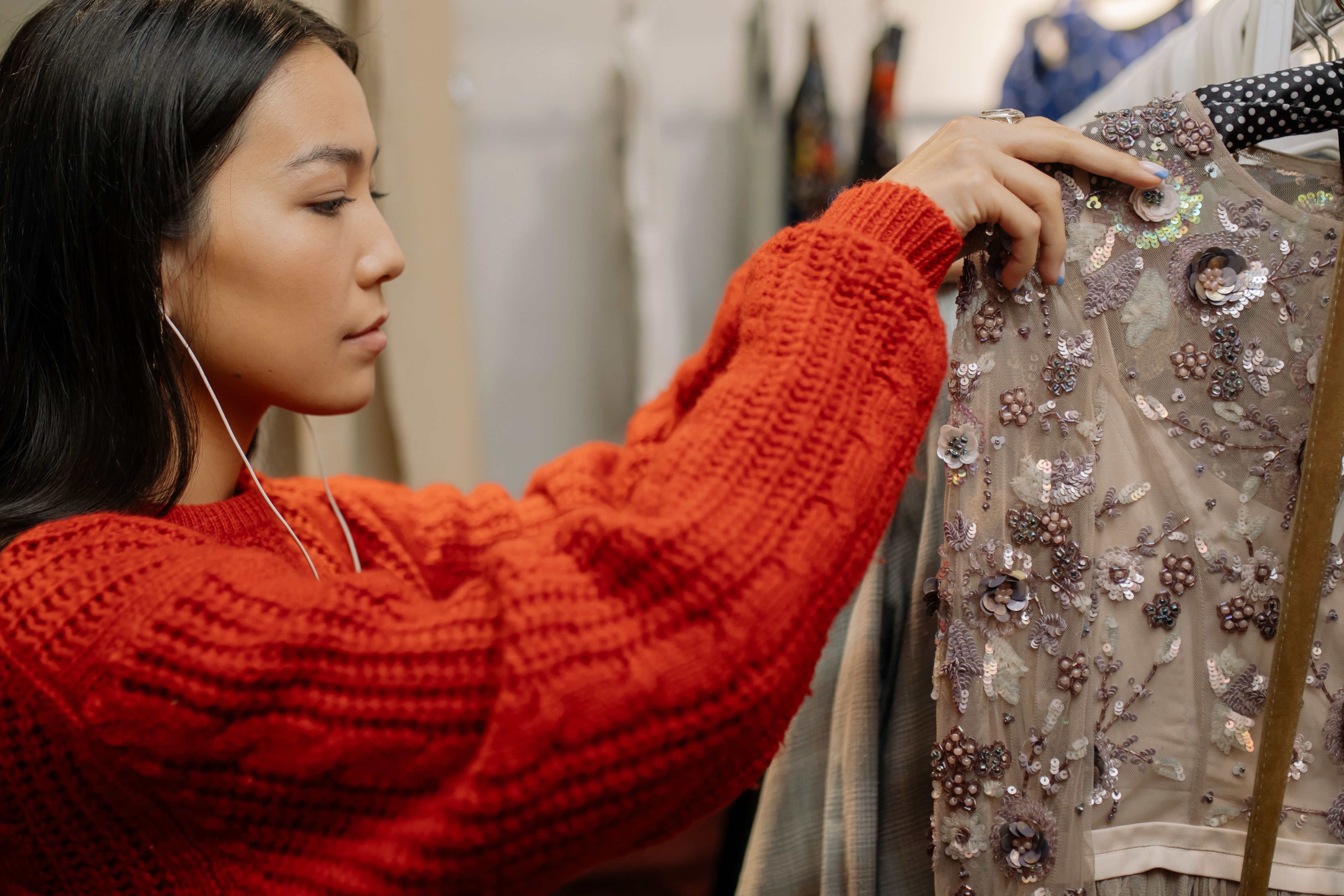 VEIMIA Asian woman choosing knitwear and clothing that feels comfortable after breast surgery
