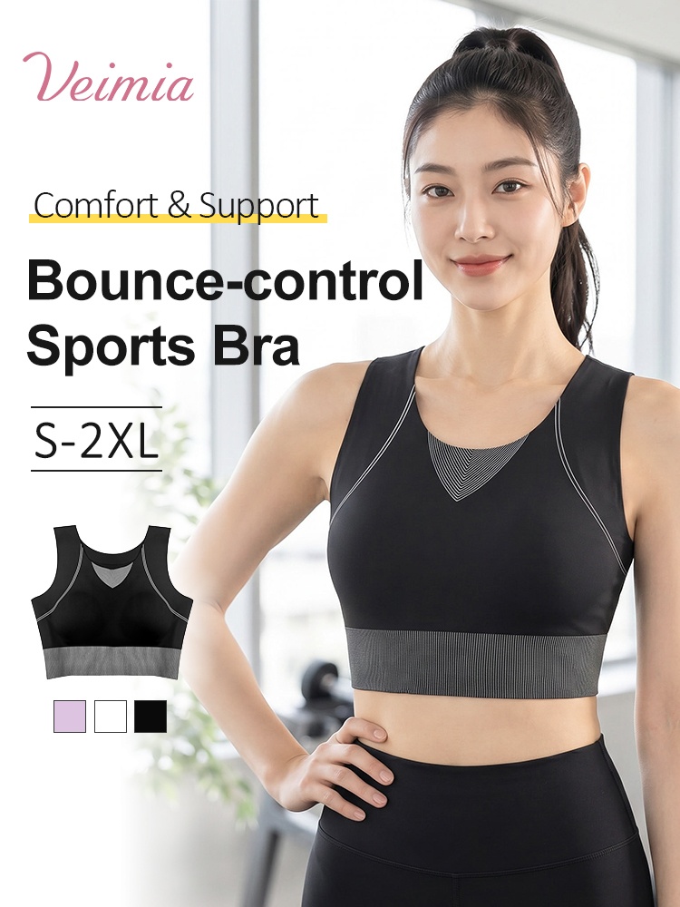 Model wearing black bounce control sports bra with wide straps VEIMIA