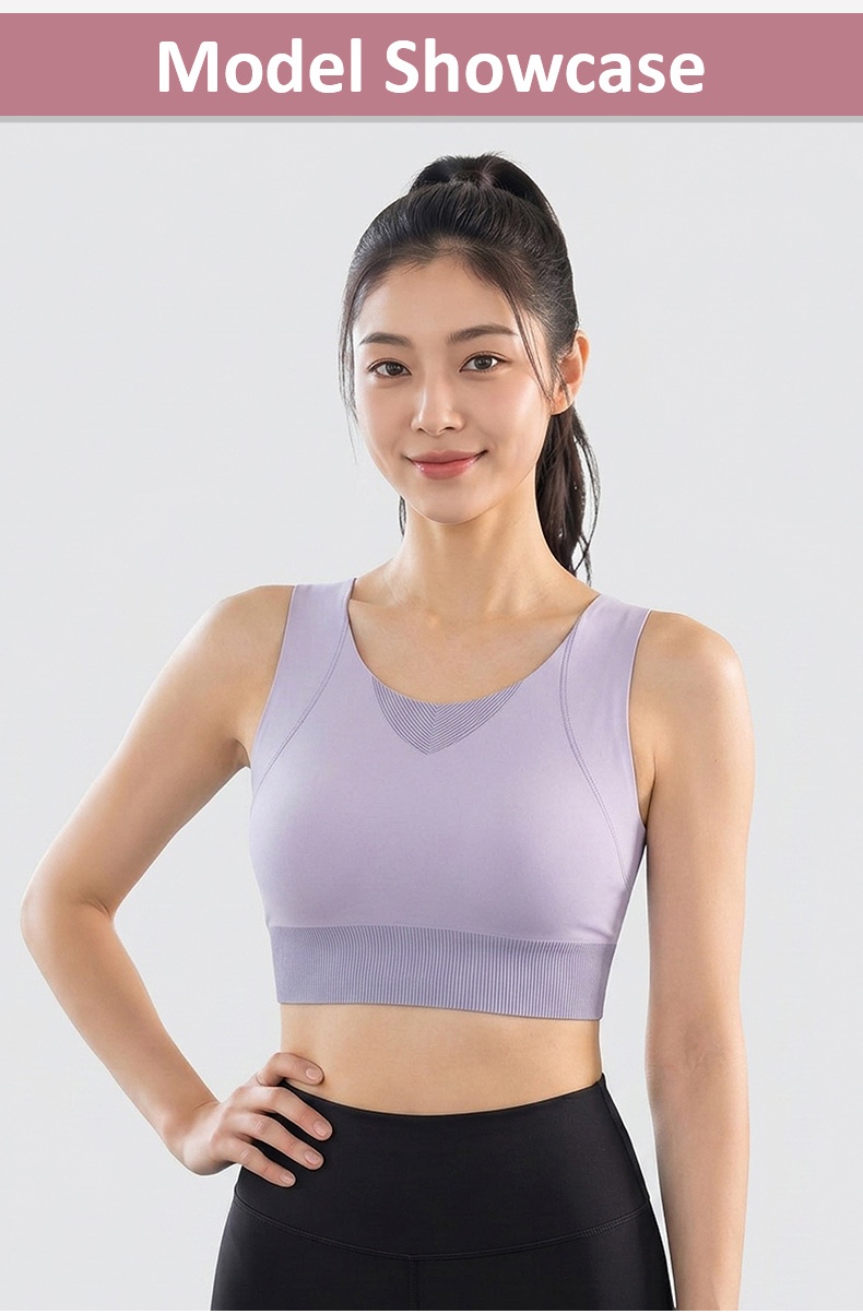 Model wearing purple sports bra front view with wide straps VEIMIA