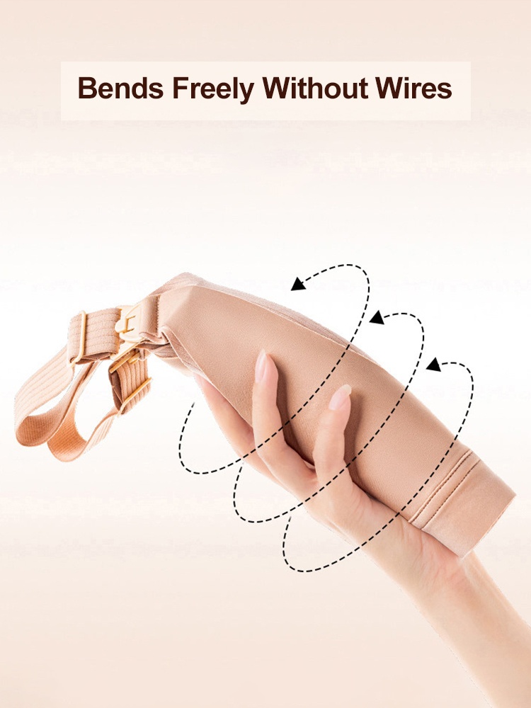Close-up demonstration of sand wireless nursing bra folded by hand to show flexibility VEIMIA