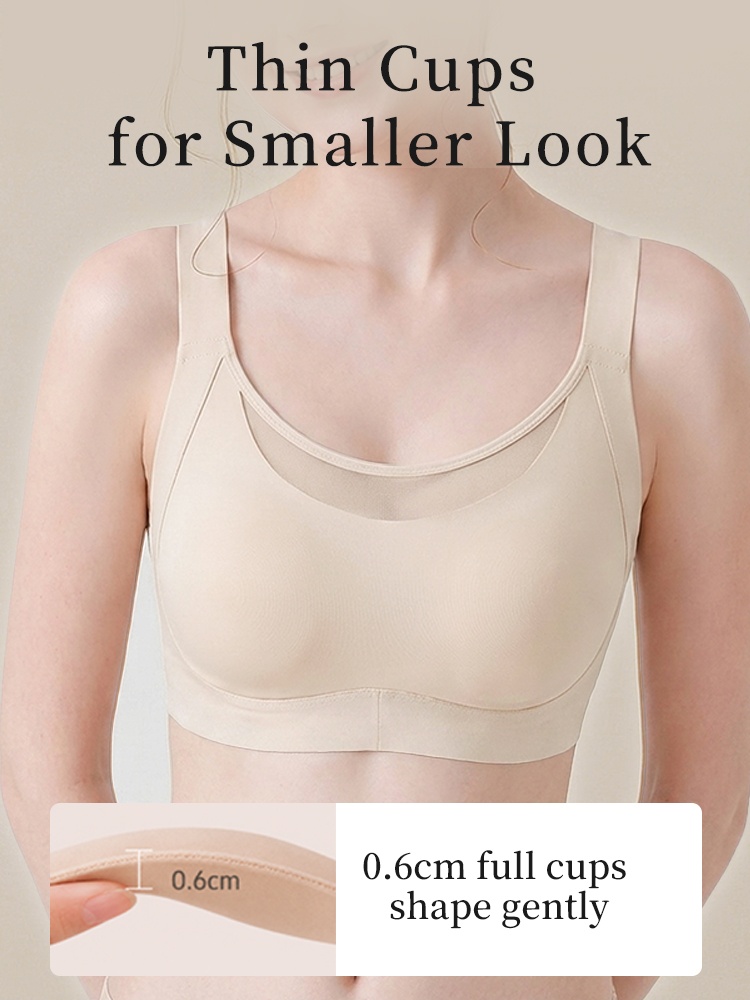 Model wearing beige minimizer bra with thin cups and full front coverage VEIMIA