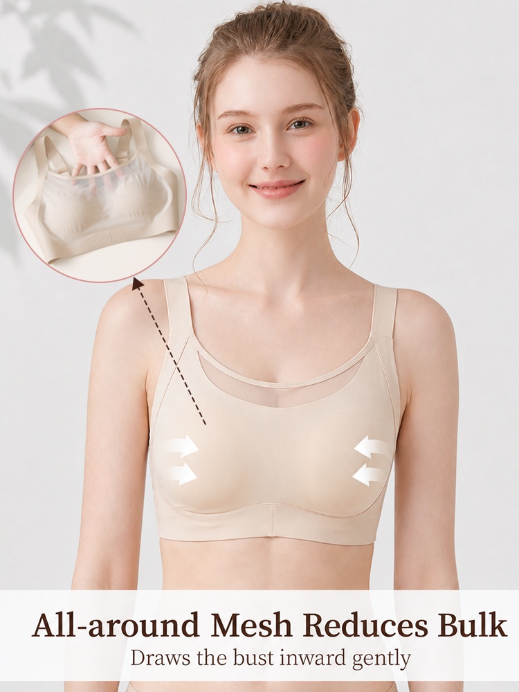 Model wearing beige minimizer bra with inward shaping mesh support arrows VEIMIA