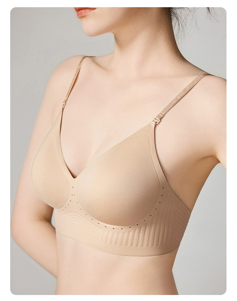 Close-up of the sand seamless bra on model showing the neckline and thin straps, VEIMIA
