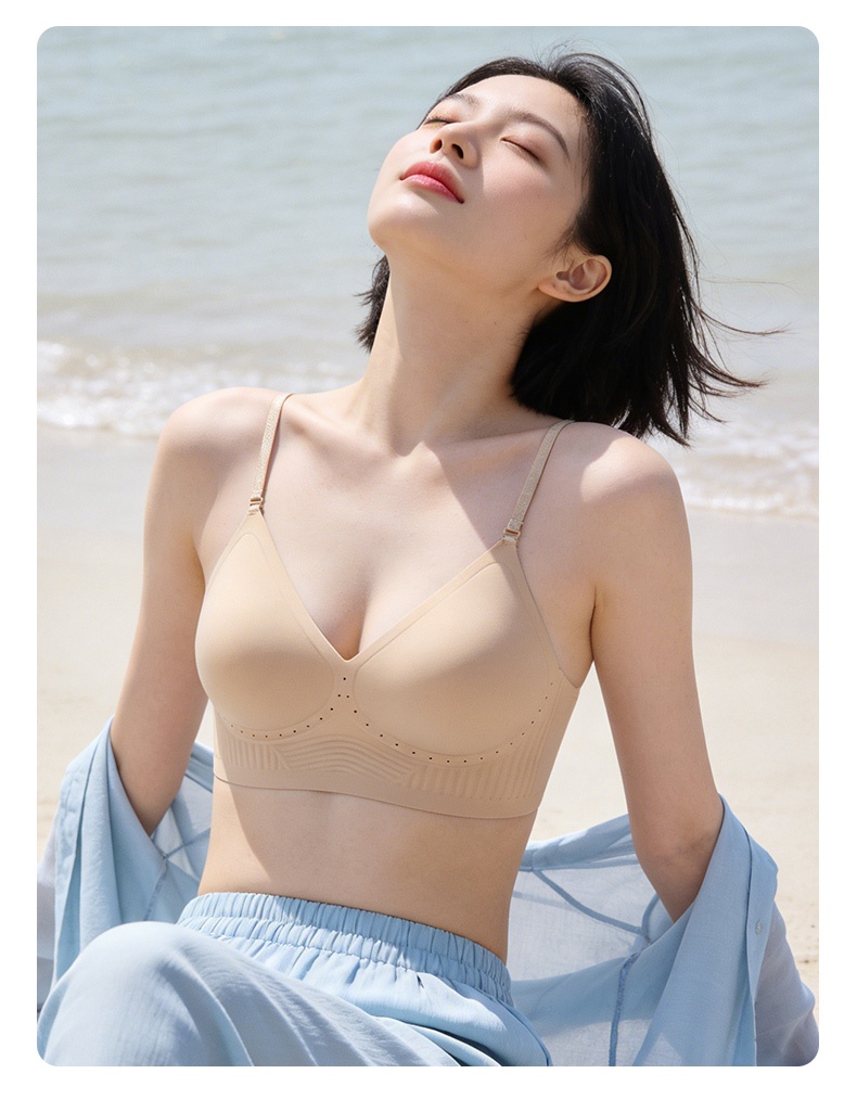 Model wearing the sand seamless bra with spaghetti straps at the beach, VEIMIA