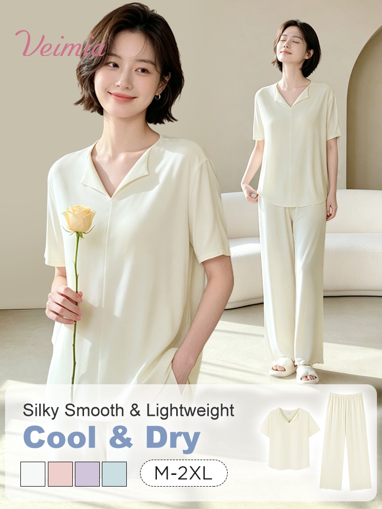 Model wearing a light yellow built-in padding pajama set with short-sleeve top and wide-leg pants - VEIMIA