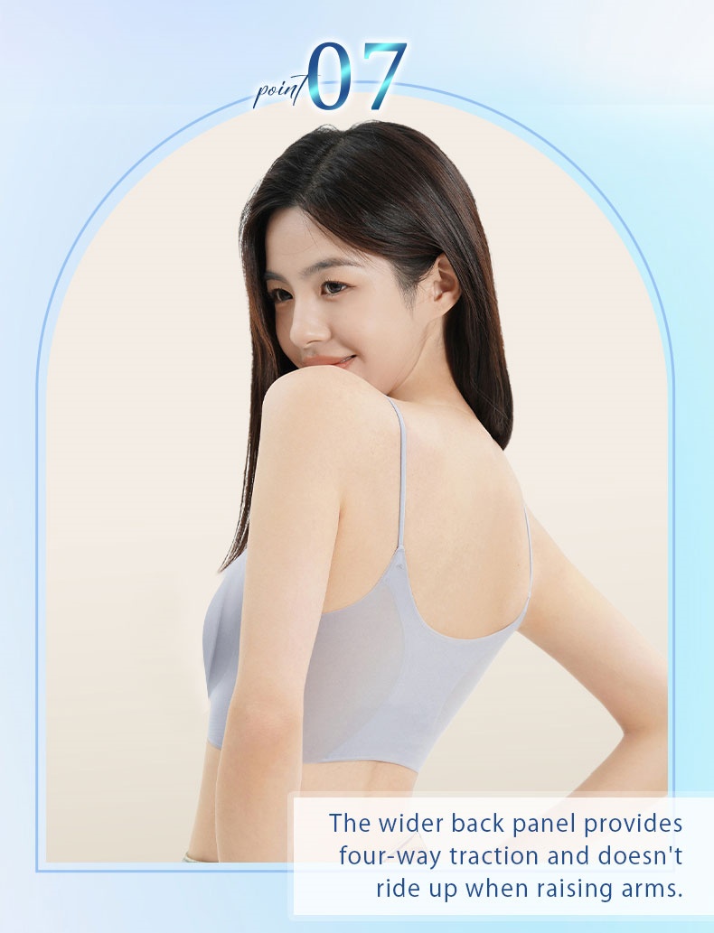 Back view of model wearing light blue seamless bra with wider back panel that does not ride up VEIMIA