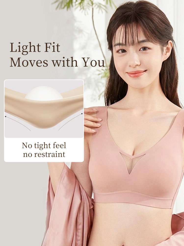 Model wearing pink V-neck bra with stretch demonstration for flexible movement VEIMIA