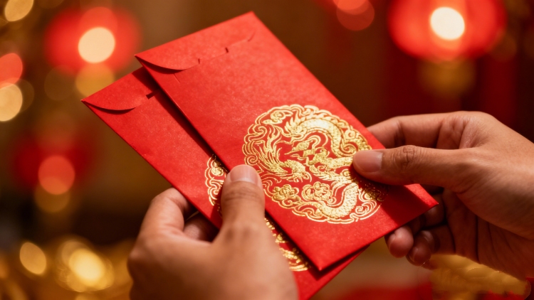 VEIMIA Chinese New Year angpao packets with mandarin oranges on a festive red table, Malaysia CNY celebration