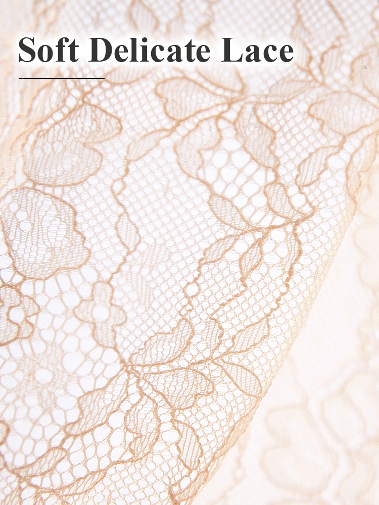 Close-up of delicate sand floral lace pattern and scalloped edge VEIMIA