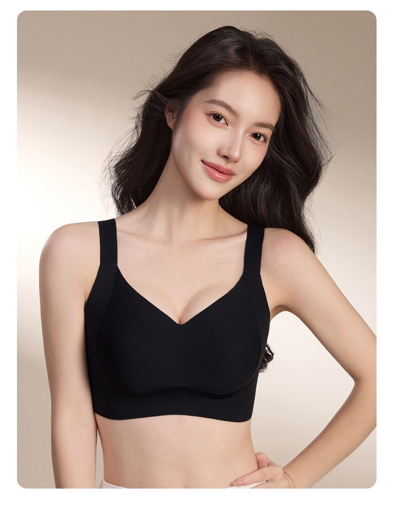 Model wearing black supportive bra with wide straps and molded cup front view VEIMIA