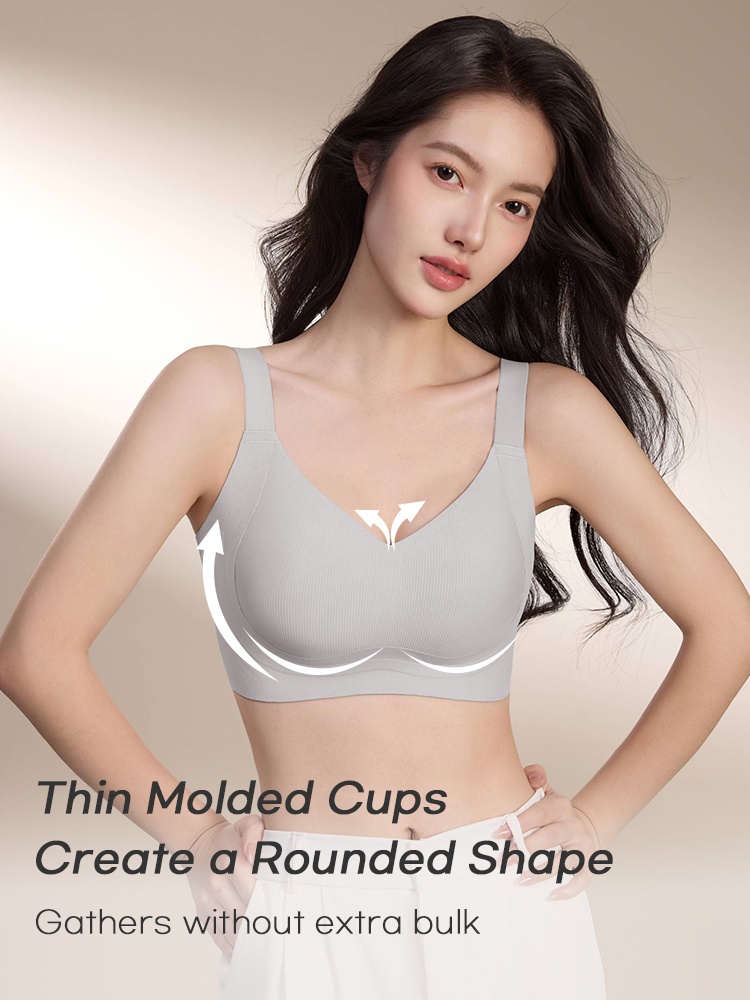 Model wearing light blue molded cup bra with arrows highlighting rounded cup shaping VEIMIA