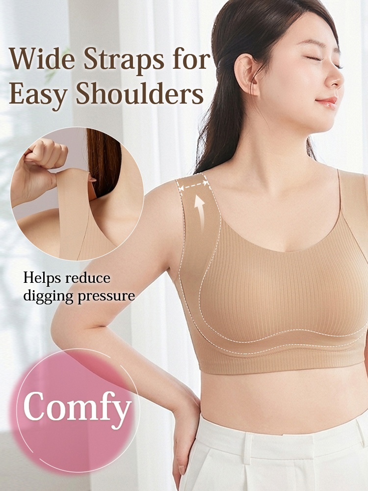 Model wearing sand seamless bra with wide shoulder straps VEIMIA