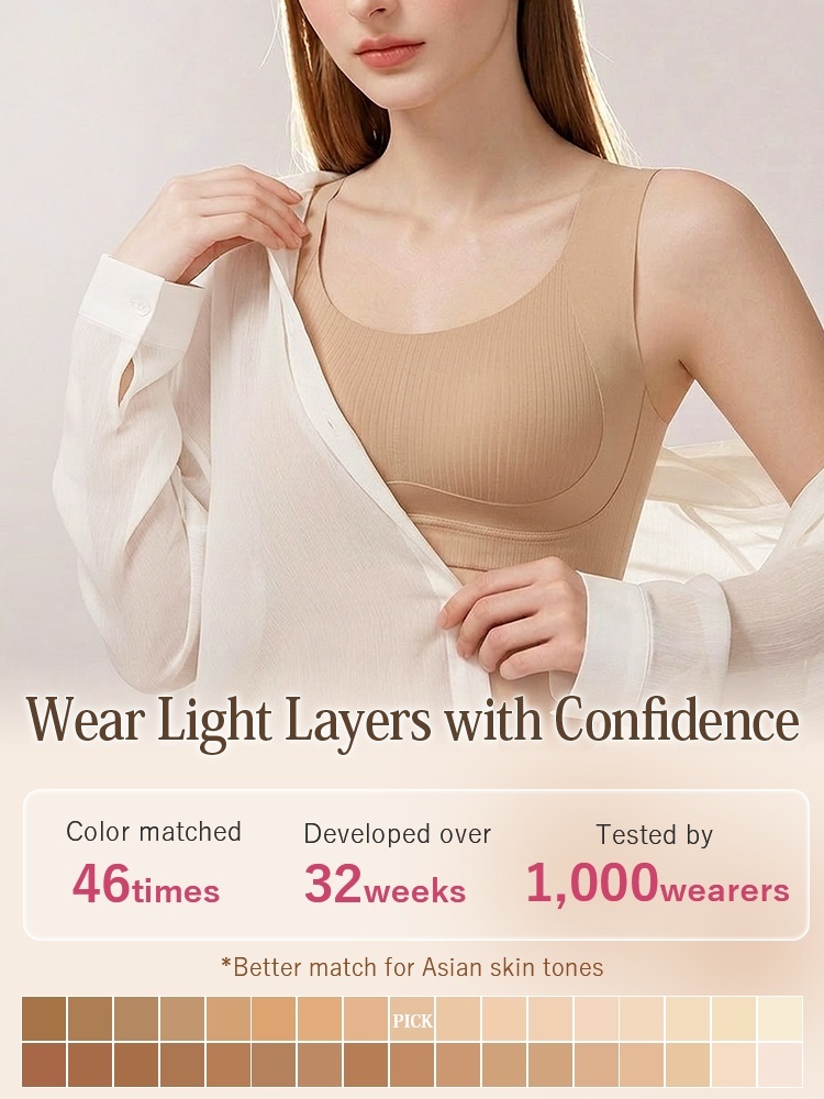 Model wearing sand seamless bra under a light white shirt VEIMIA